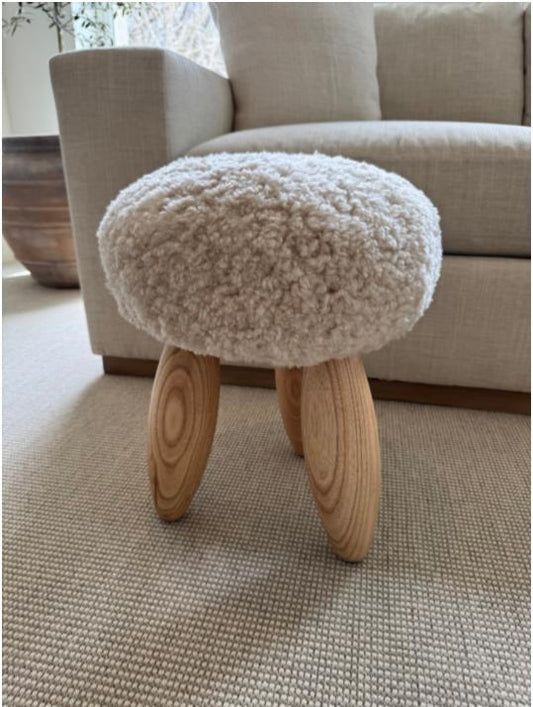 Sheep Skin Stool in Ivory (next to sofa)