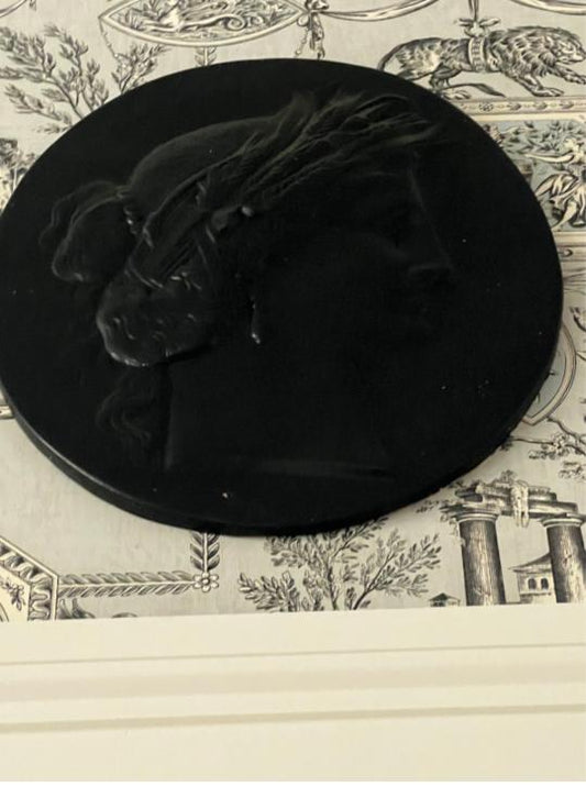 large pair of black painted intaglios